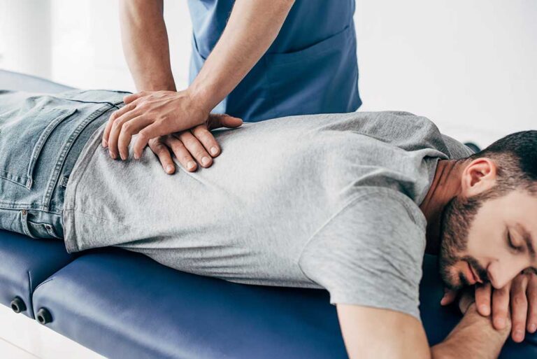 Person performing gentle chair-supported mobility exercises in a bright home setting.